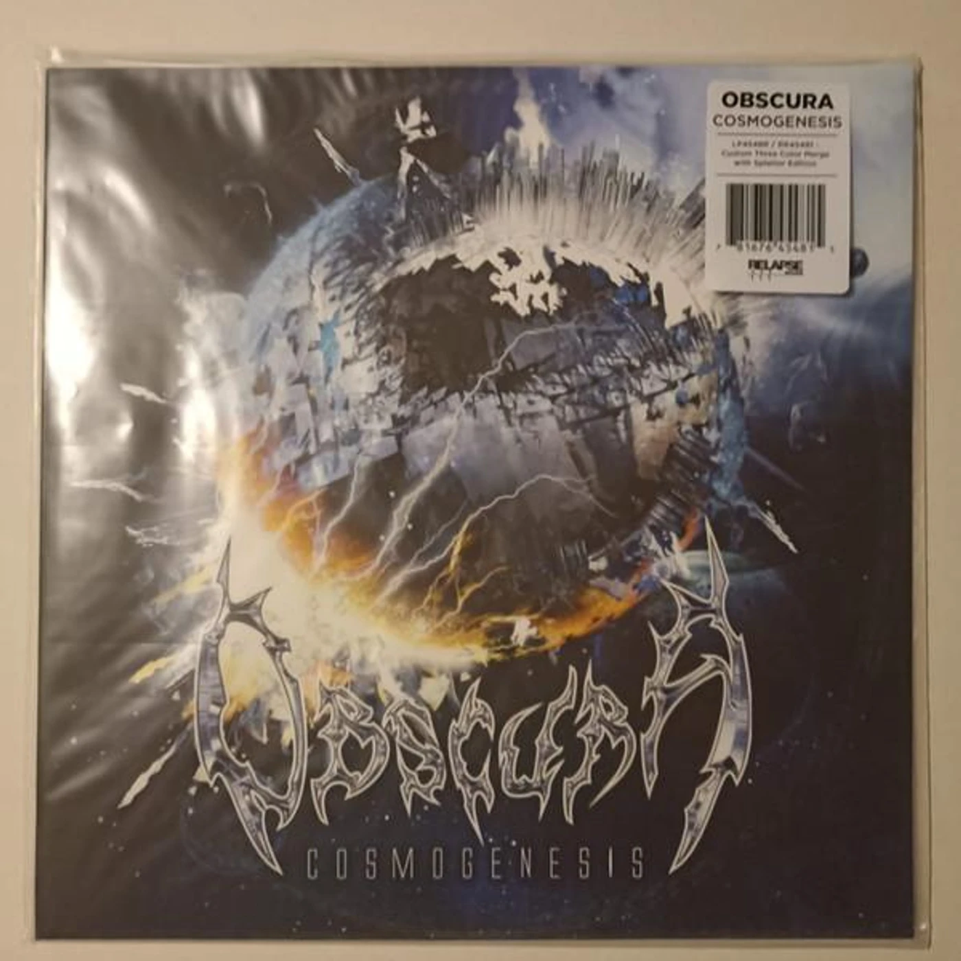 Obscura COSMOGENESIS (ORANGE, SILVER & ROYAL BLUE MERGE W/ ORANGE KRUSH, SILVER & ROYAL BLUE SPLATTER VINYL) Vinyl Record
